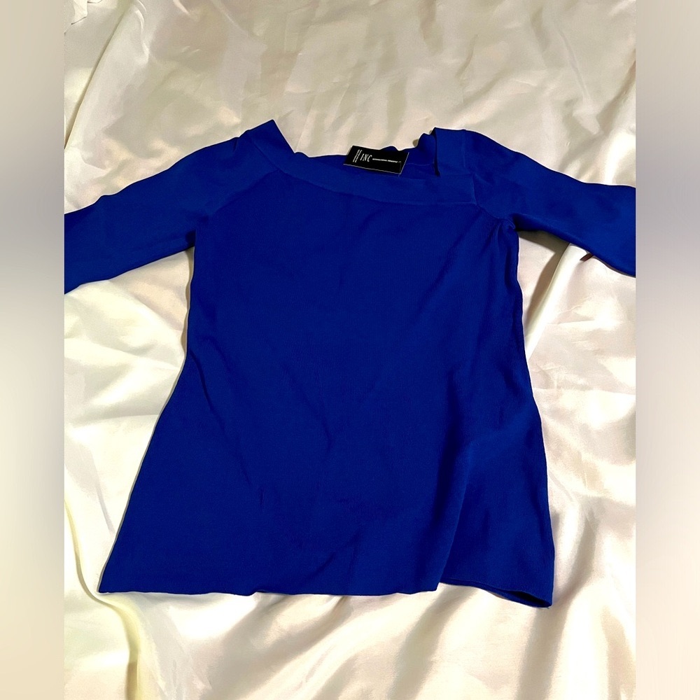 INC Royal blue stretch top, 3/4 length sleeves w/ asymmetrical neck. Never worn.